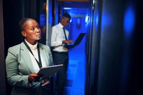 Thinking, programming and black woman in server room, tablet for software d.. Stock Photos