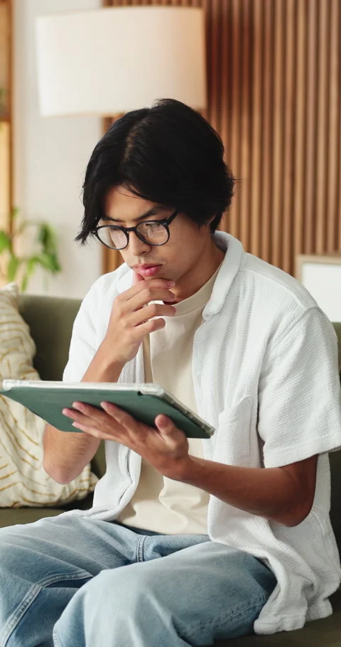 Thinking, reading and asian man with tablet for remote work, system maintenance Stock Footage 331654142