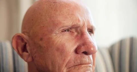 Thinking, regret and elderly man in home with memory, loss or remembering of Stock Photos