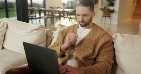 Thinking, remote work and man with laptop on couch, planning and website testing Stock Footage 335275737