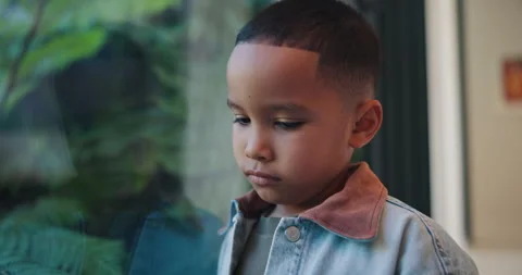 Thinking, sad and boy by window in home with reflection of trauma, bad memory Stock Footage 336649890