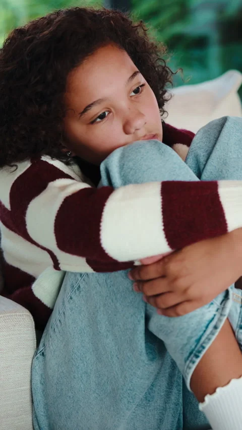 Thinking, sad and child on sofa in home with reflection for trauma, loneliness Stock Footage 335852989