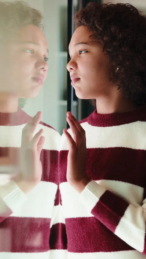 Thinking, sad and child by window in home with reflection for bad memory Stock Footage 335850718