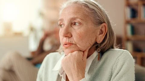 Thinking, sad and memory with old woman on sofa for Alzheimer, retirement and 스톡 사진