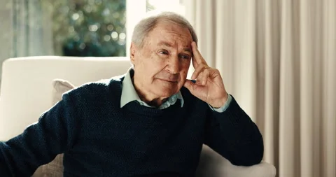 Thinking, sad and old man in home with headache, anxiety trigger and regret with Video stock 342096556