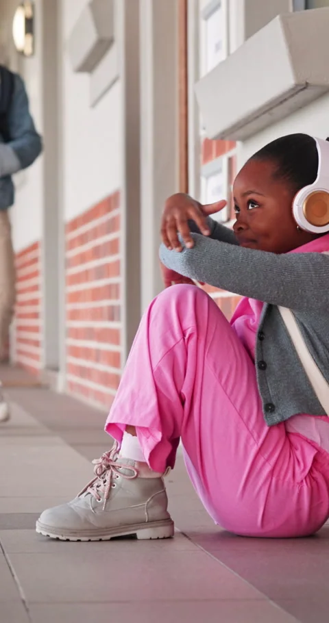Thinking, sad or girl at elementary school with headphones, anxiety or child Stock Footage 341420379