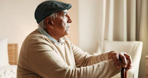 Thinking, sad or old man in house with walking stick, loss or memory of pas.. Stock Photos
