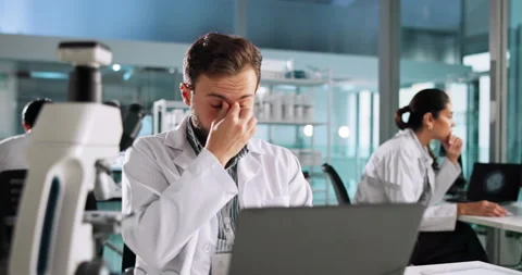 Thinking, scientist and man with headache, lab and stress for deadline of Stock Footage 305170144