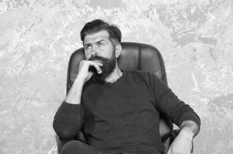 Thinking on serious problem. Serious hipster relax in chair. Serious look of Foto stock