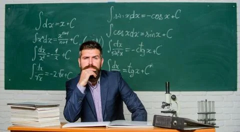 Thinking on serious problem. Serious teacher touching beard by hand. Bearded man Foto stock