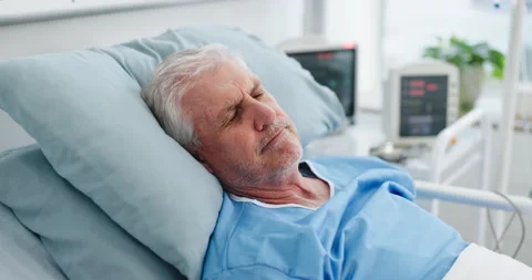 Thinking, sick and senior man in hospital bed with stress, surgery fail and Stock Footage 321944756