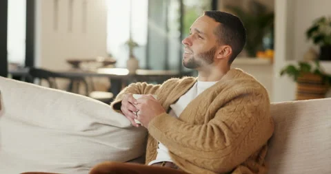 Thinking, smell or man with coffee on sofa, morning inspiration or remember Stock Footage 335303459