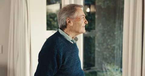 Thinking, smile and senior man at window with insight, daydreaming and nostalgia Stock Footage 342095725