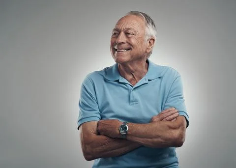 Thinking, smile or old man in studio with arms crossed, nostalgia or positi.. Stock Photos
