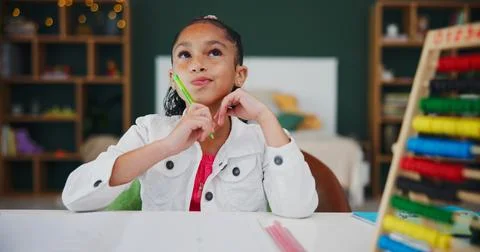 Thinking, student and homework with child in home for brainstorming, math s.. Stock Photos