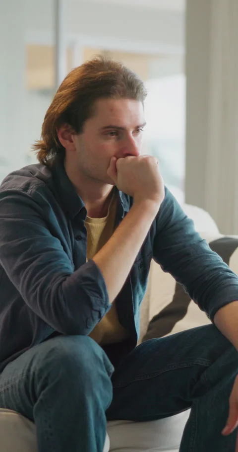 Thinking, student and man on sofa with worry for future decision, college Stock Footage 335904338