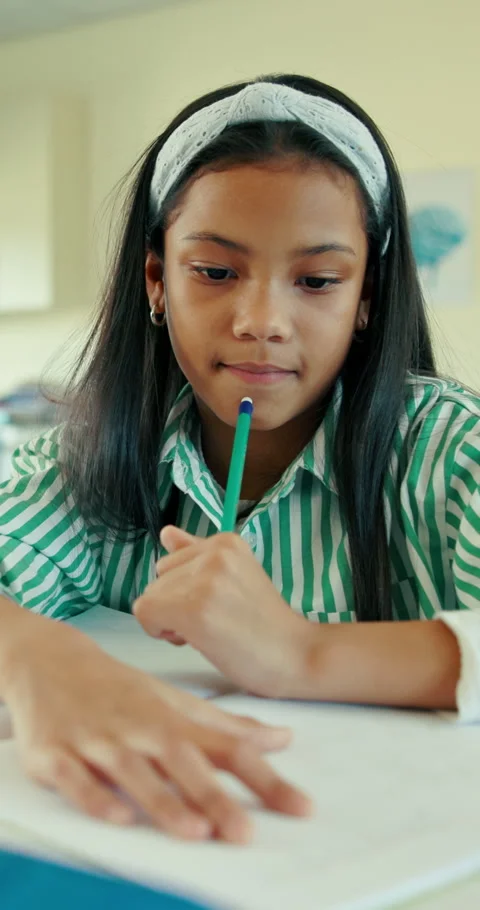 Thinking, student or girl in classroom with pencil for math quiz, writing answer Stockbeeldmateriaal 321874845