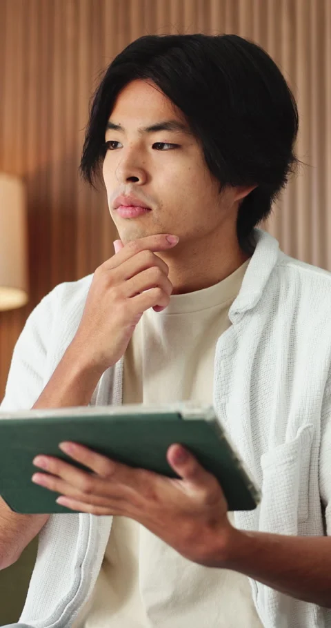 Thinking, tablet and asian man with remote work in house, social media campaign Stock Footage 331655529