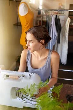 Thinking, tailor and working with sewing machine, woman and ideas in workshop Stock Photos