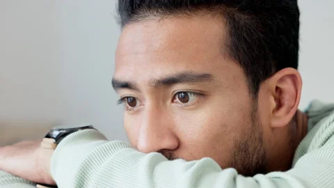 Thinking, tired and serious young male resting his eyes while sad and depressed Stock Footage 204848613