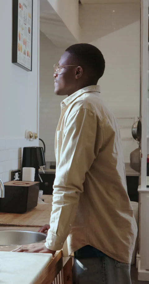 Thinking, window and black man in kitchen, decision and contemplation for memory Stock Footage 333741917