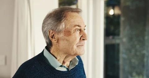 Thinking, window and senior man in house with reflection, memory or reminder of Stock Photos