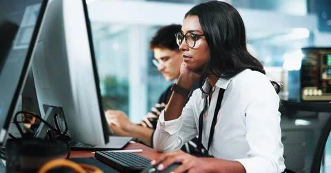 Thinking, woman and developer on computer in office for programming, software Foto stock