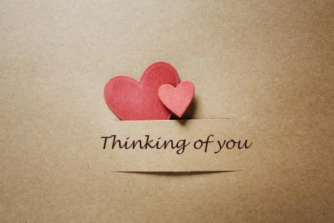 Thinking of you message with red paper hearts Stock Photos