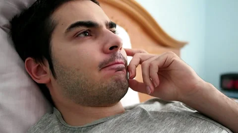 Thinking Young Man In Bed Stockbeeldmateriaal 27306863