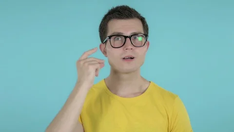 Thinking Young Man Got New Idea Isolated on Blue Background Stock Footage 112979381