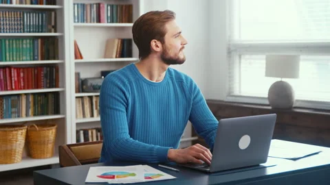 Thinking young man at home office. Young male professional using computer Stock Footage 172279774