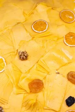 Thinly sliced cheese on a dish close-up Stock Photos
