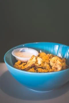 Thinly sliced eggplant battered and deep fried then served with sweet mayonna Stock Photos