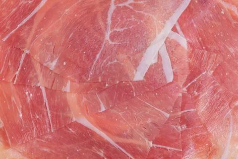 Thinly sliced ham meat macro photo as background. Stock Photos