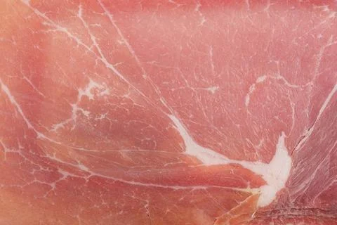 Thinly sliced ham meat macro photo as background. Foto stock