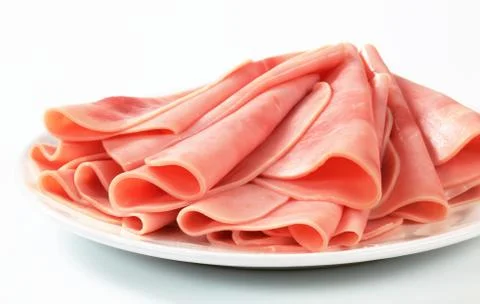 Thinly sliced ham on a plate Stock Photos