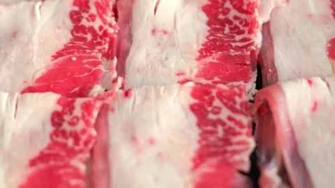 Thinly Sliced Raw Beef for Shabu Shabu Stock Footage 345686825