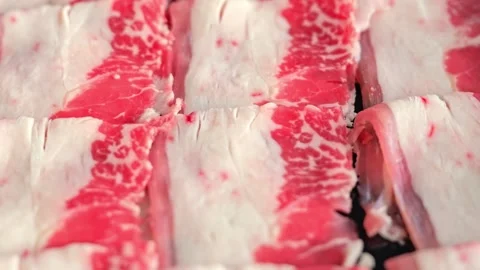 Thinly Sliced Raw Beef for Shabu Shabu Stock Footage 345686848