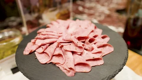 Thinly Sliced Roast Beef Appetizer Served on a Black Slate Plate Stock Footage 333364429