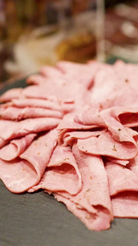 Thinly Sliced Roast Beef Platter Served on a Slate Board Stock Footage 333658822