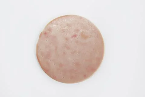 Thinly sliced round pieces of ham sausage Stock Photos