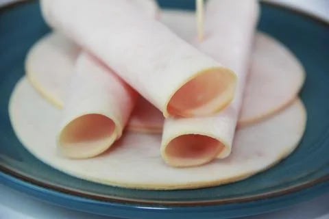 Thinly sliced round pieces of ham sausage Stock Photos