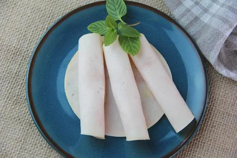 Thinly sliced round pieces of ham sausage Stock Photos