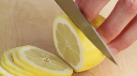Thinly slicing a lemon Stock-Footage 24665512