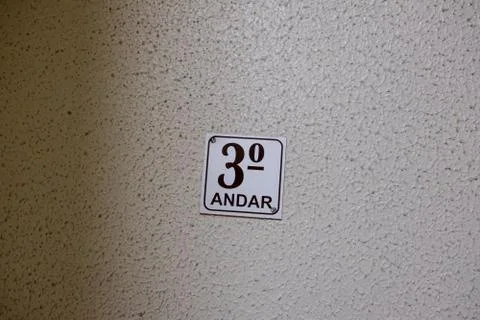 Third floor sing in staircase Stock Photos