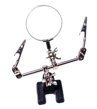 The third hand device with clamps and magnifier for holding smal Stock Photos