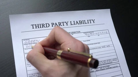 Third Party Liability - Hand Filling the Document Closeup Stock-Footage 79838985
