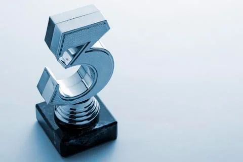 Third place runner up silver trophy on grey Stock Photos