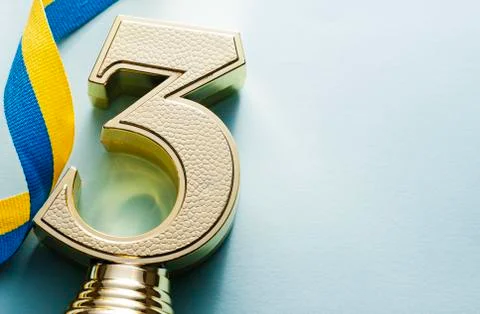 Third placed runner up textured gold trophy Foto stock