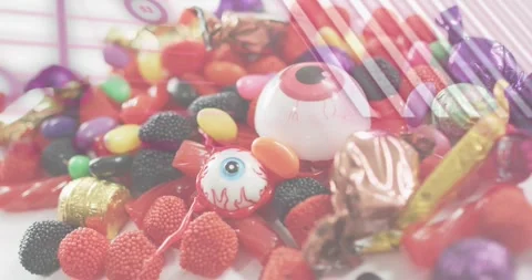 Third-second purple grid overlaying candy pile starting code bars floating Stock Footage 317772367